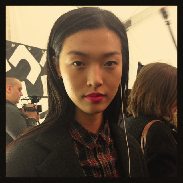 Bold pink lip at DVF Fall 2013 backstage