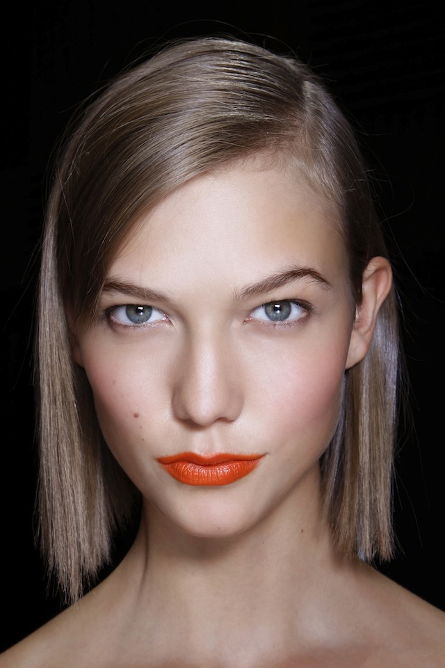 Model with orange lipstick Model with orange lipstick