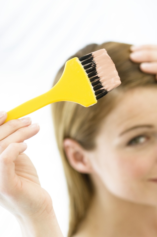 woman dyeing hair woman dyeing hair